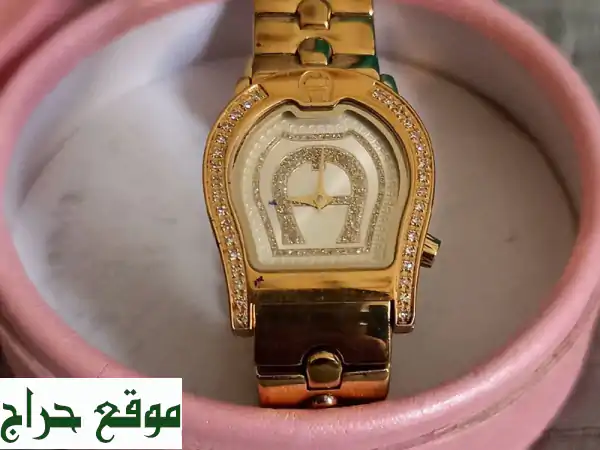 تألقي بفخامة Aigner Verona: ساعة نسائية سويسرية أصلية بالذهب والماس | 1500 درهم