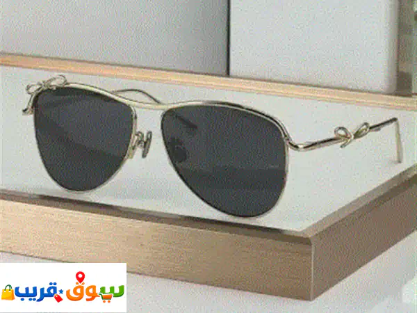 نظارة شمسية نسائية بتصميم أنيق وفاخر للبيع اطار معدني ذهبي بتفاصيل مميزة على شكل فيونكة، وعدسات ... 2