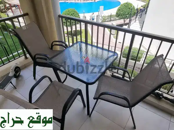 Garden or Balcony Dining table set with four chairs and umbrella