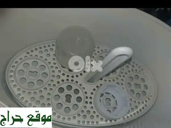 فرصة مميزة: معقم تومي تيبي (Tommee Tippee) للرضاعات مستعمل بحالة جيدة - تعقيم فعال وآمن لطفلك!