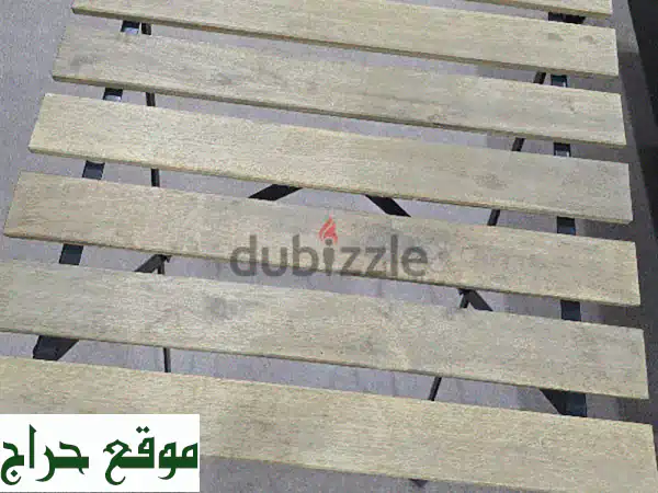 حوّل مساحتك الخارجية: طاولة حديقة خشبية أنيقة...