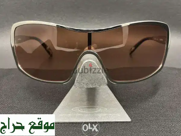 نظارة شمسية Oakley Remedy ذهبية - إطار ذهبي، عدسات برونزية...