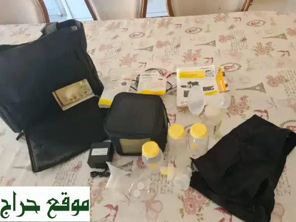 مضخة حليب ميديلا مزدوجة - بحالة ممتازة! (مستعملة قليلاً)