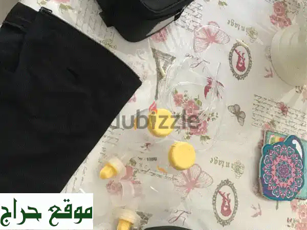 مضخة حليب ميديلا مزدوجة - بحالة ممتازة! (مستعملة قليلاً)