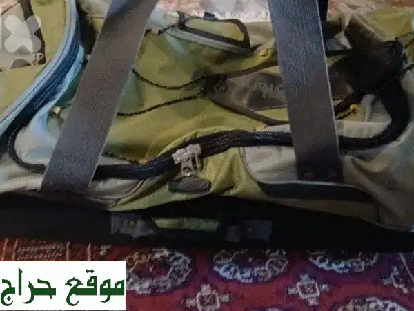 شنطة تخييم أصلية عملاقة (ظهر وعجلات) | بحالة الجديد | مثالية لرحلاتك ومغامراتك!