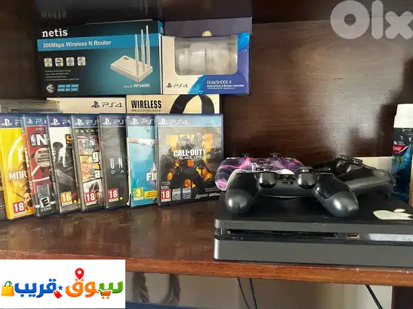 بلايستيشن 4 (PS4) نظيفة جداً | 10 ألعاب و 3 أيادي تحكم -...