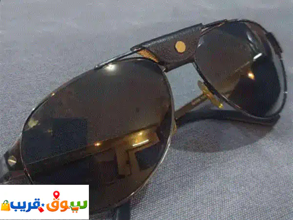 نظارة شمسيه كارتير cartier أصليه اصدار خاص. اطار مميز لونين أسود وذهبي بتصميم فاخر تفاصيل مسامير ...