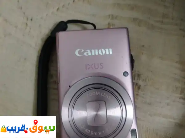 من الصورة يظهر انها كاميرا canon ixus باللون الوردي،...